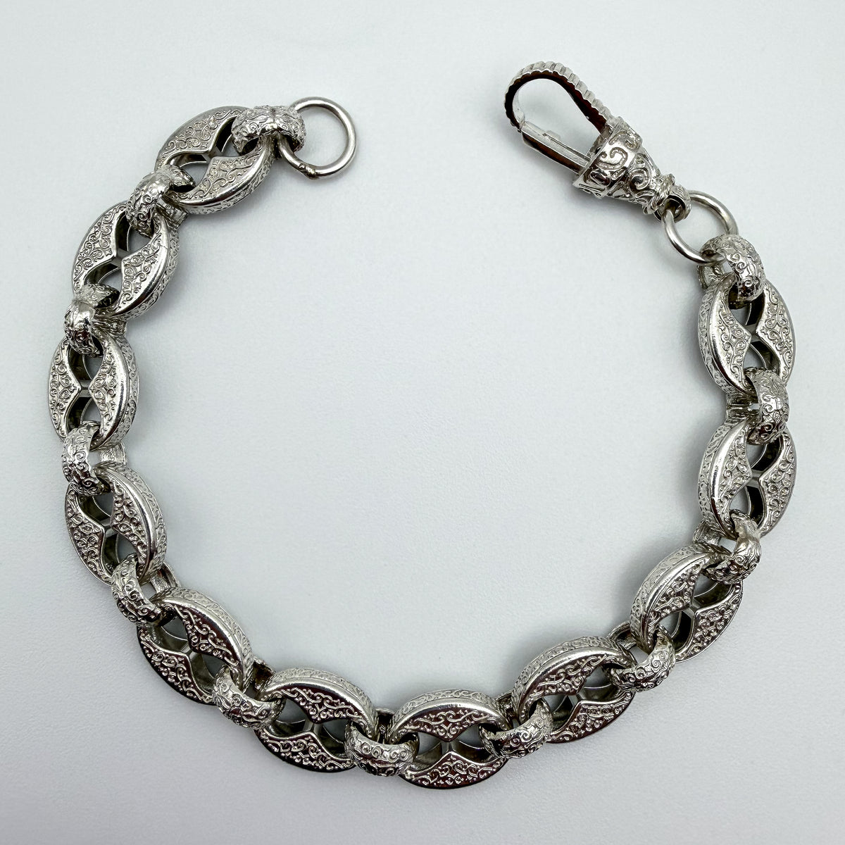 925 sterling silver Button & Belcher link bracelet, 9 inches long, photographed on white background