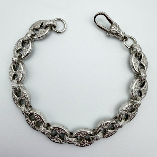 925 sterling silver Button & Belcher link bracelet, 9 inches long, photographed on white background