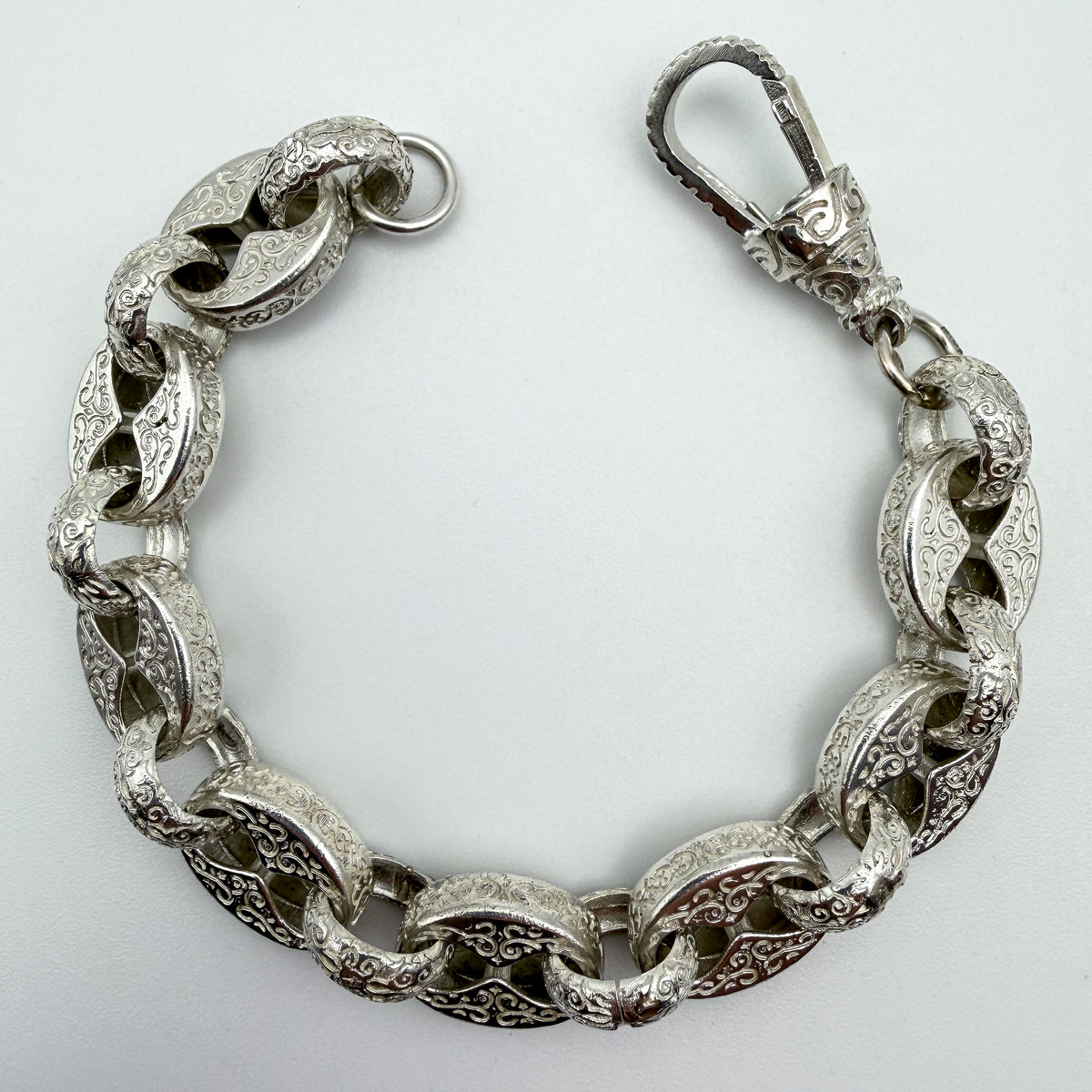 925 sterling silver Button & Belcher link bracelet, 8.5 inches long, photographed on white background