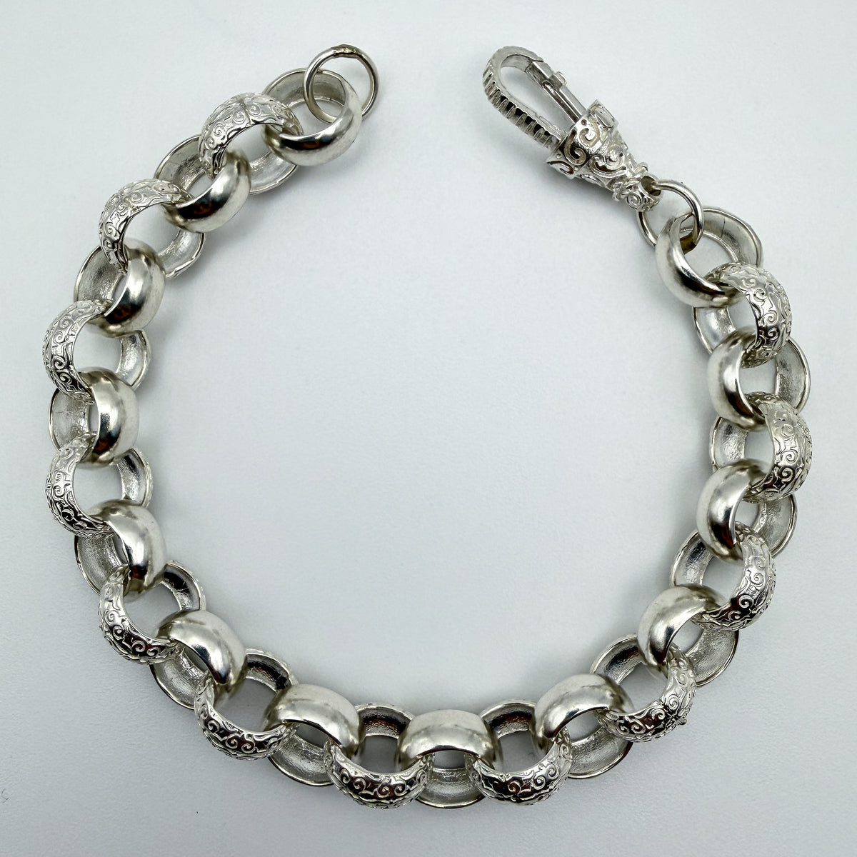 925 sterling silver Plain & Patterned Belcher link bracelet, 9 inches long, photographed on white background