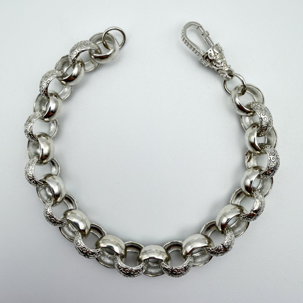 925 sterling silver Plain & Patterned Belcher link bracelet, 9 inches long, photographed on white background